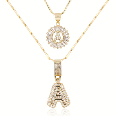 Pair of 14k Gold Initial Necklaces Adorned with Diamonds