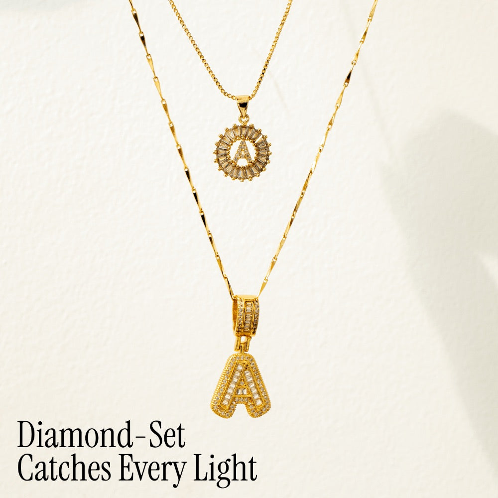 Pair of 14k Gold Initial Necklaces Adorned with Diamonds