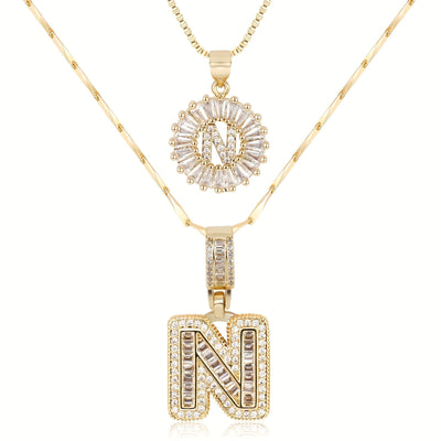 Pair of 14k Gold Initial Necklaces Adorned with Diamonds