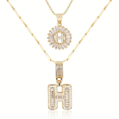 Pair of 14k Gold Initial Necklaces Adorned with Diamonds