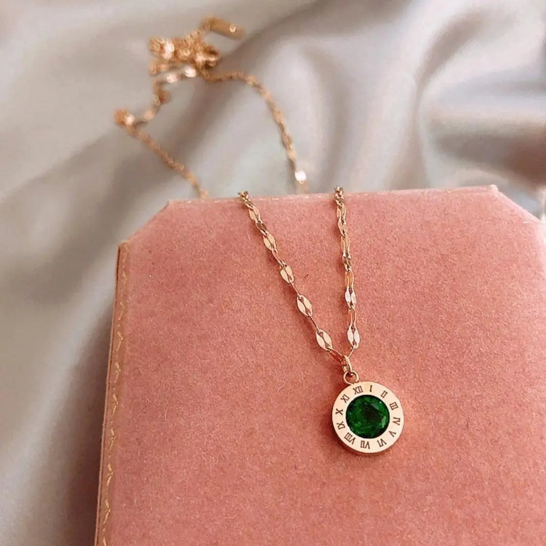 Emerald Timepiece Pendant on Gold Necklace