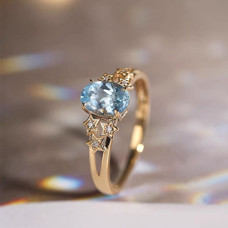 Premium Gold Ring Featuring a Blue Crystal
