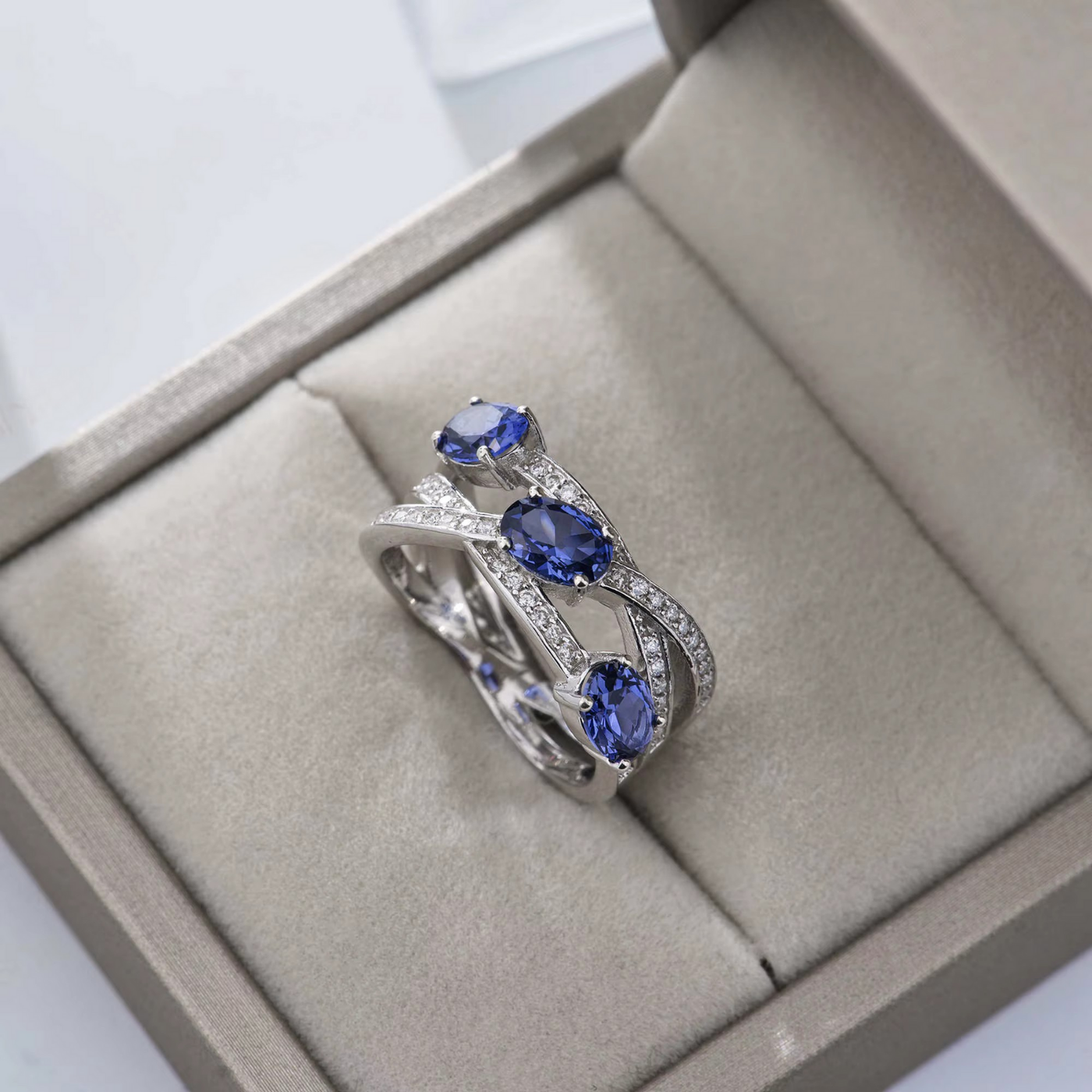 Infinity Ring with Round Moissanite and Sapphire Accents