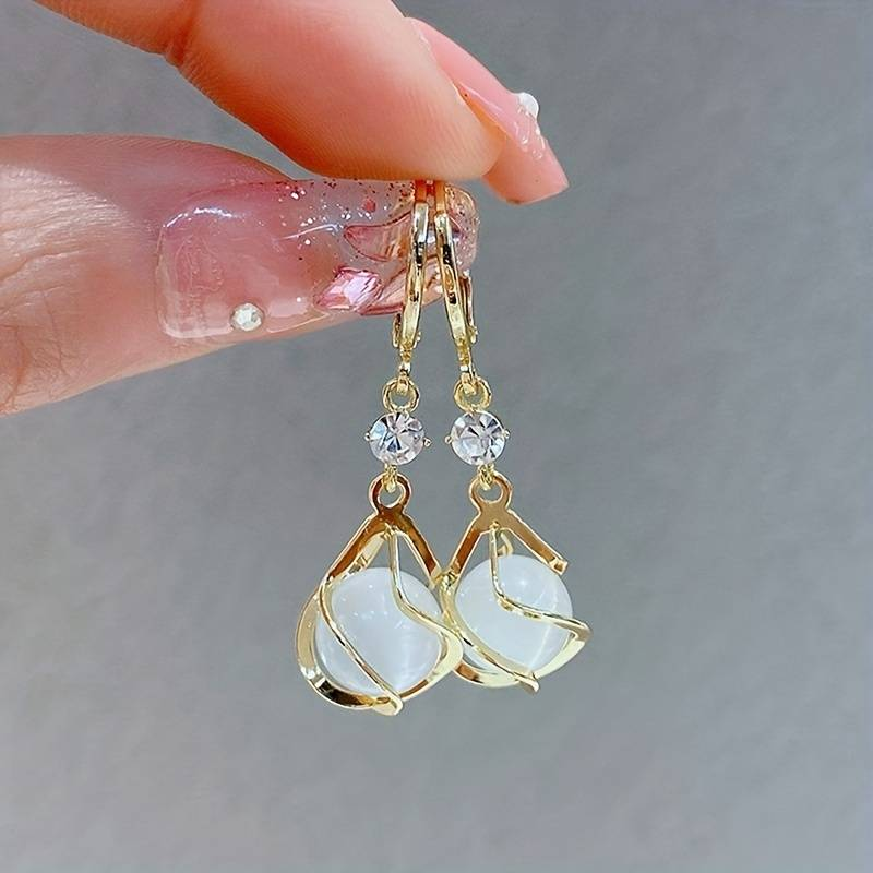 Chic Vintage Gold Earrings Featuring a Dazzling White Opal