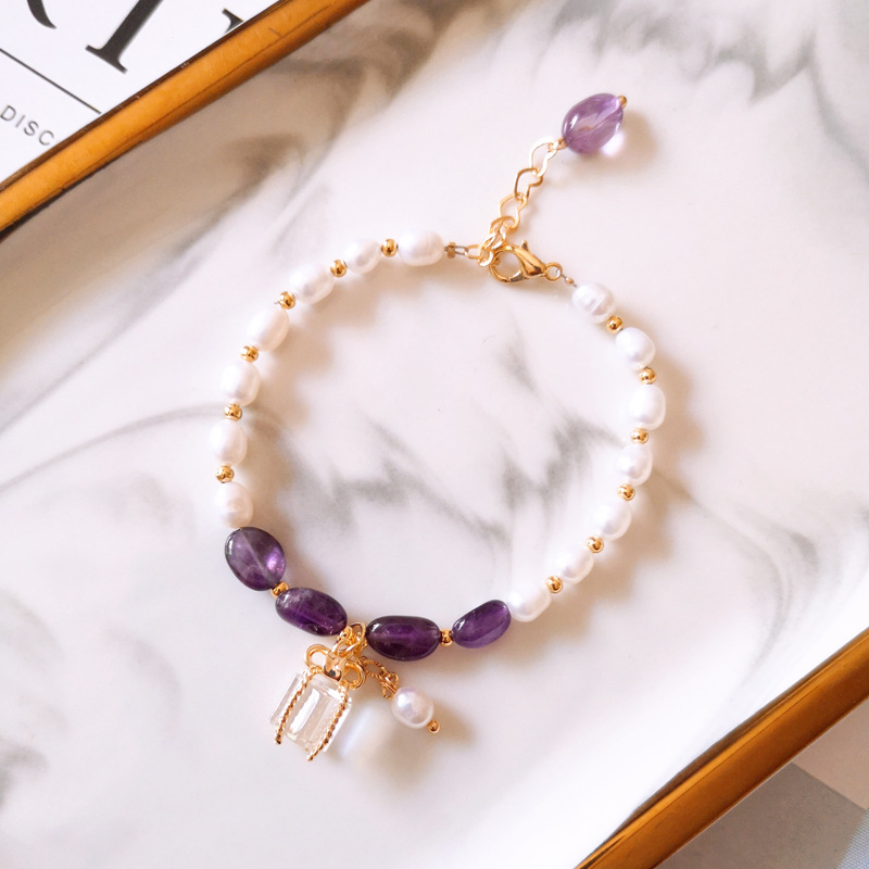 Gold Bracelet Adorned with Purple Stones and Pearls
